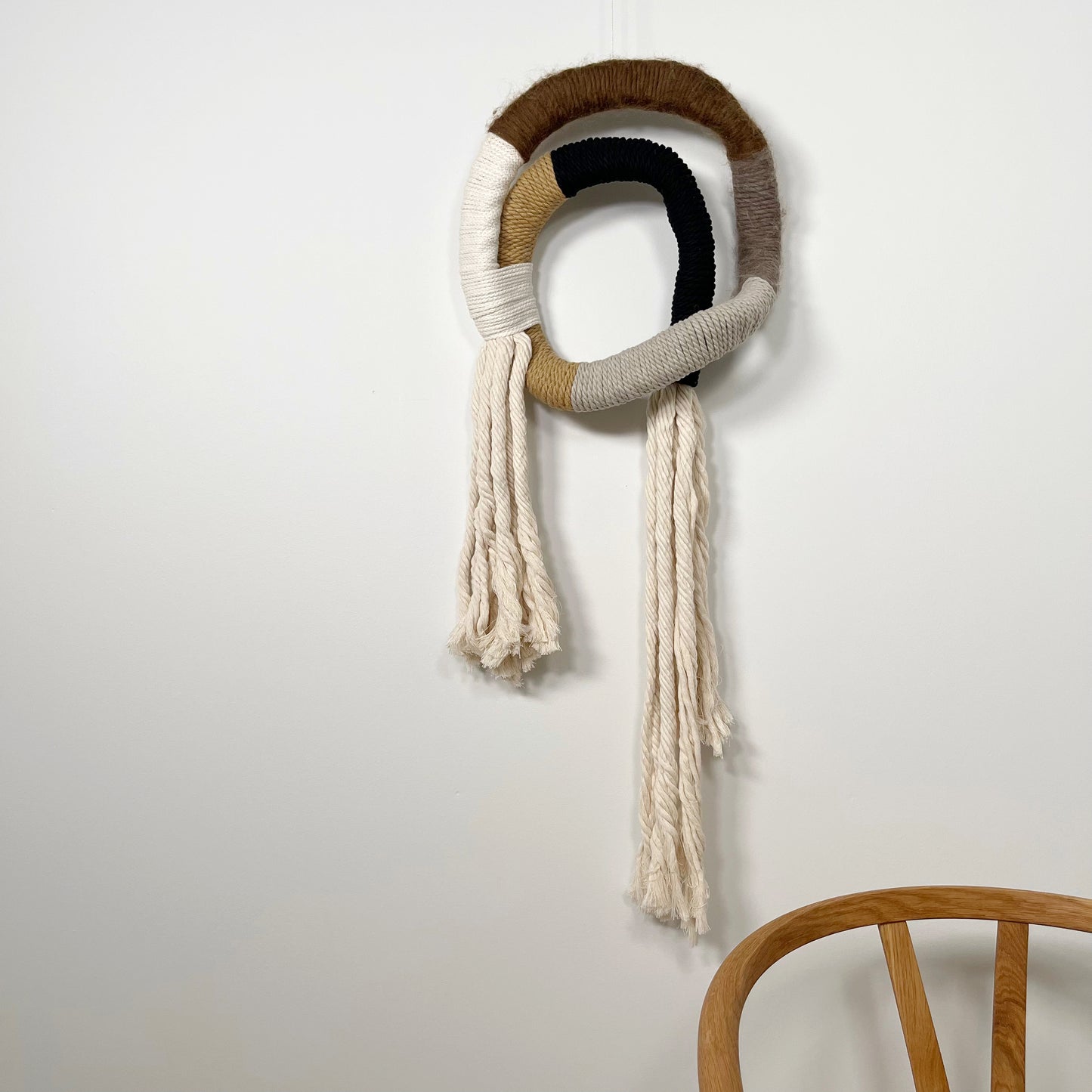 wrapped wall hanging in neutral colors