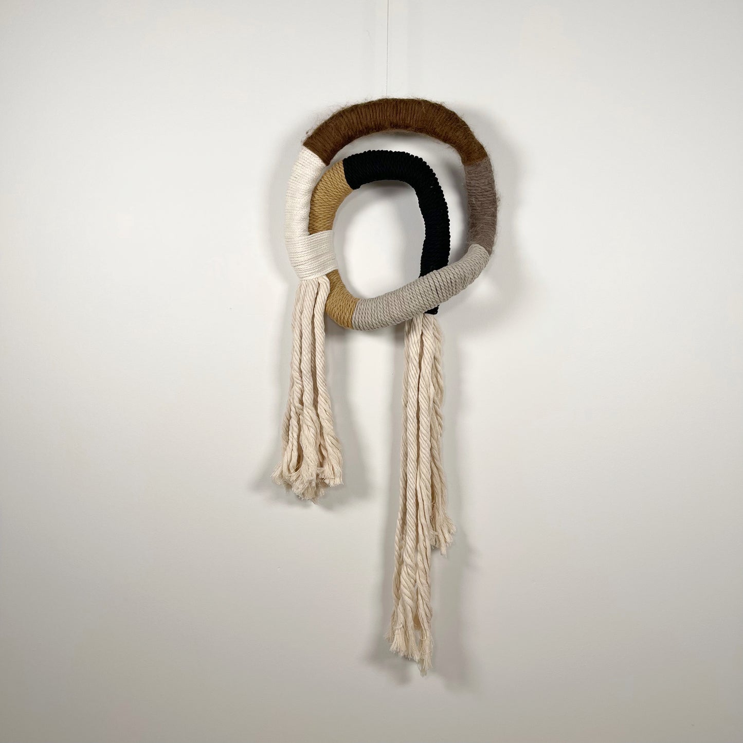 wrapped wall hanging in neutral colors