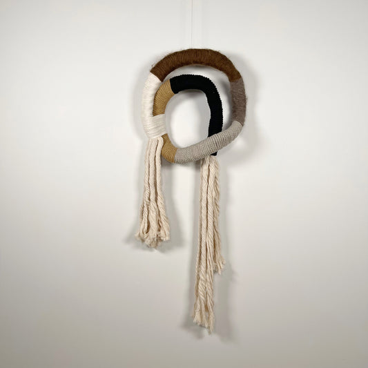 wrapped wall hanging in neutral colors