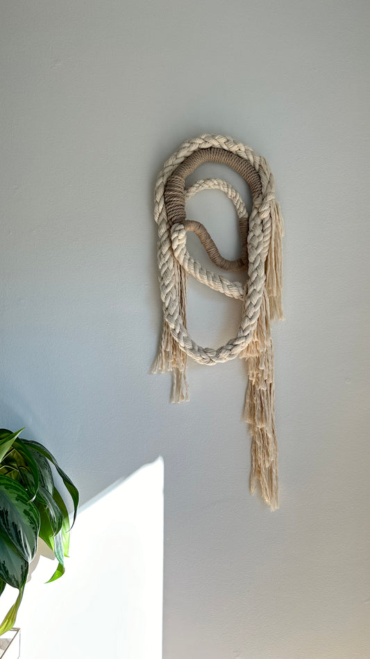 Wall Hanging made of natural colored and tan rope.