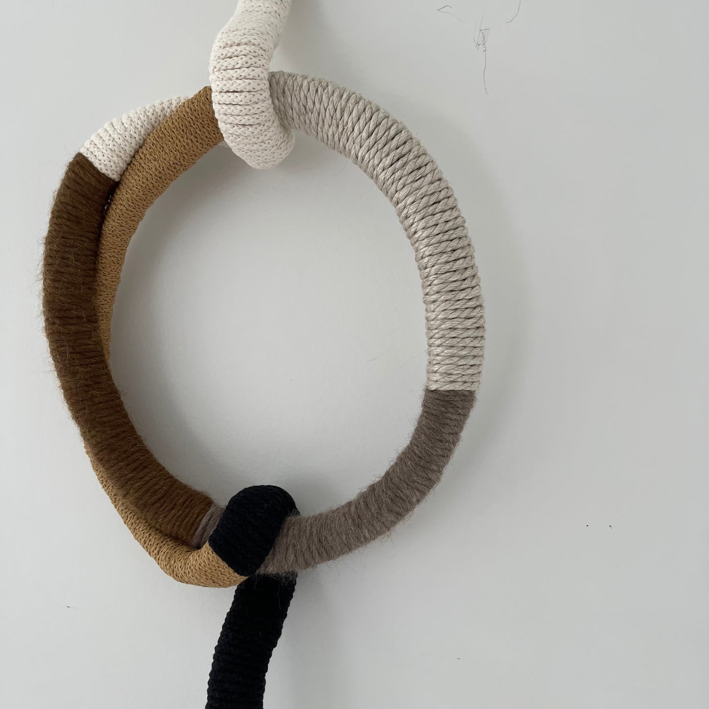 wrapped wall hanging in neutral colors