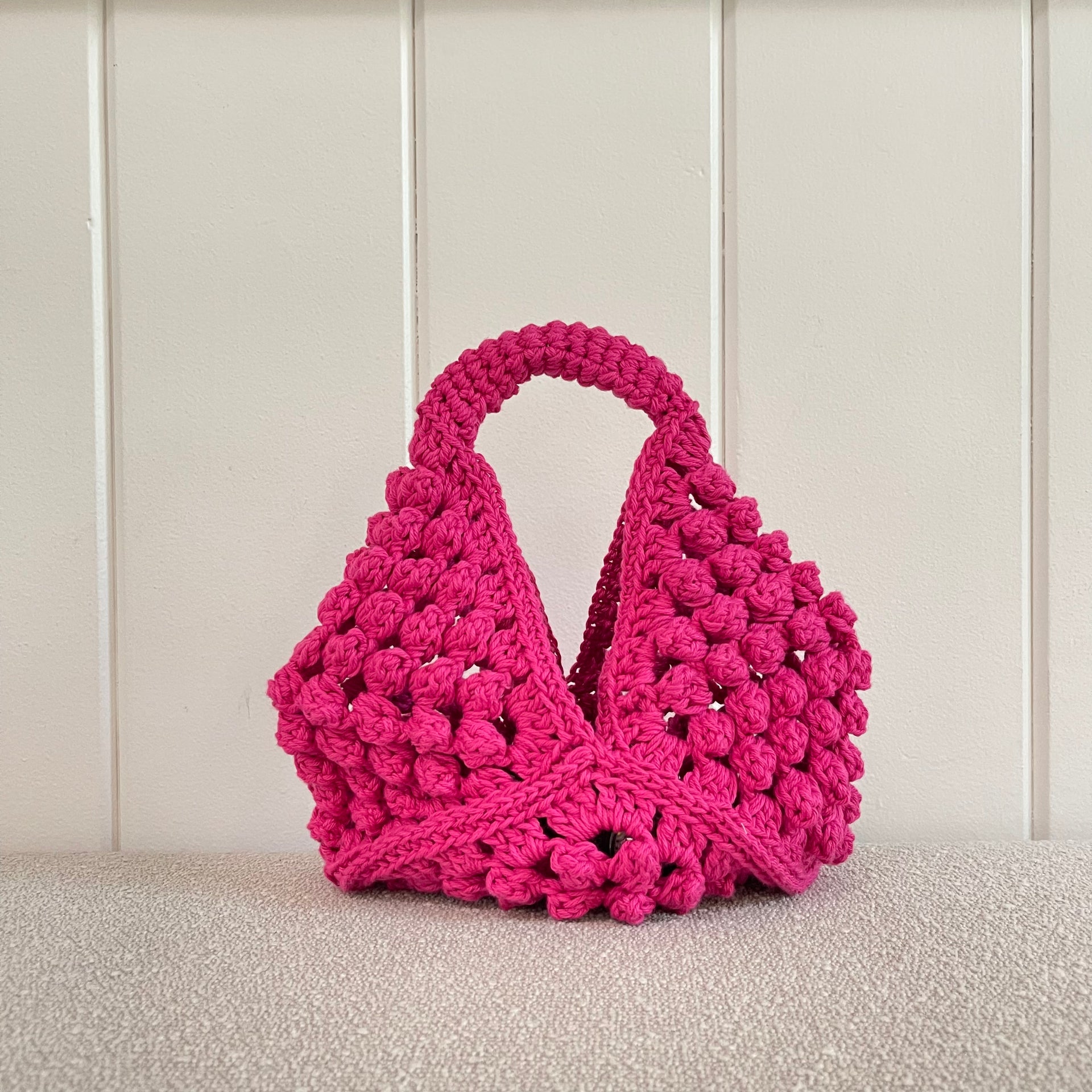 Colorful crochet bag and craft supplies