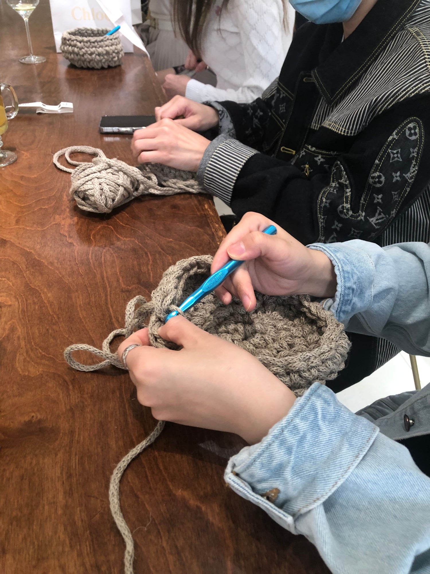Women learning to crochet at Chloe southcoast plaza