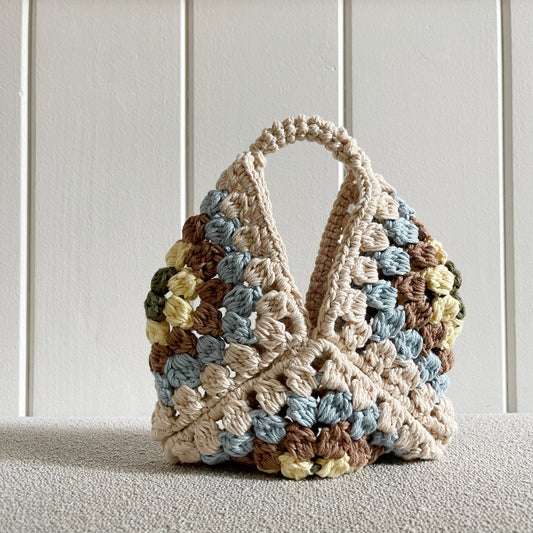 rochet granny square handbag  Measures 11 by 9 inches. Made of 100% cotton in colors cream, baby blue, light brown, light yellow and military green. 